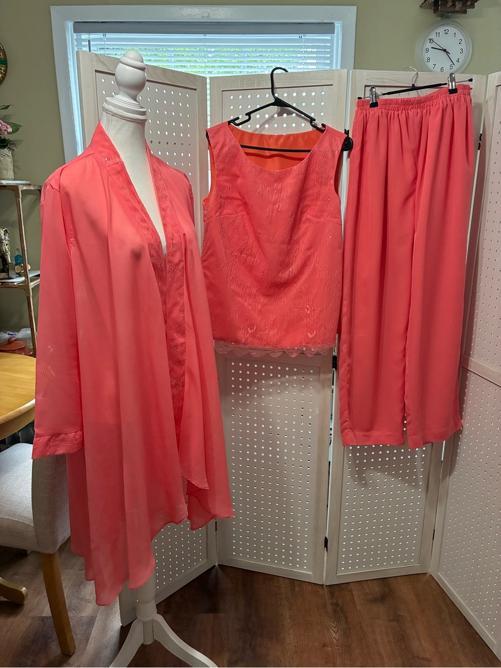 This is a coral 3-piece chiffon pantsuit for formal occasions.